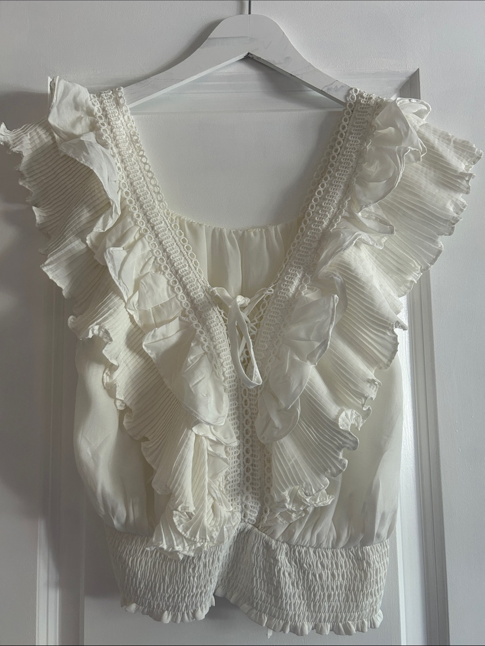 vestique white frilly top